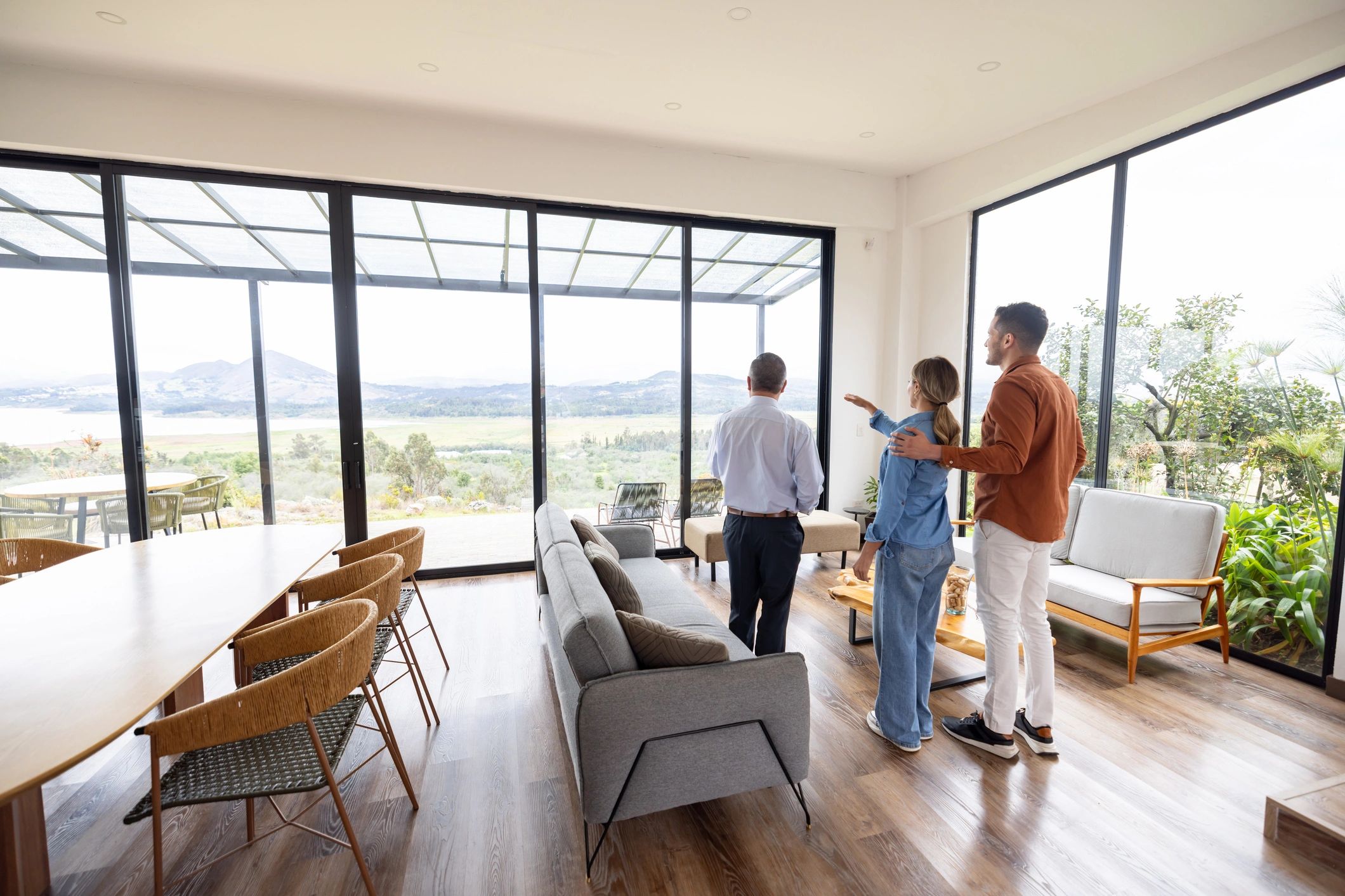 Real estate clients touring a property with an agent