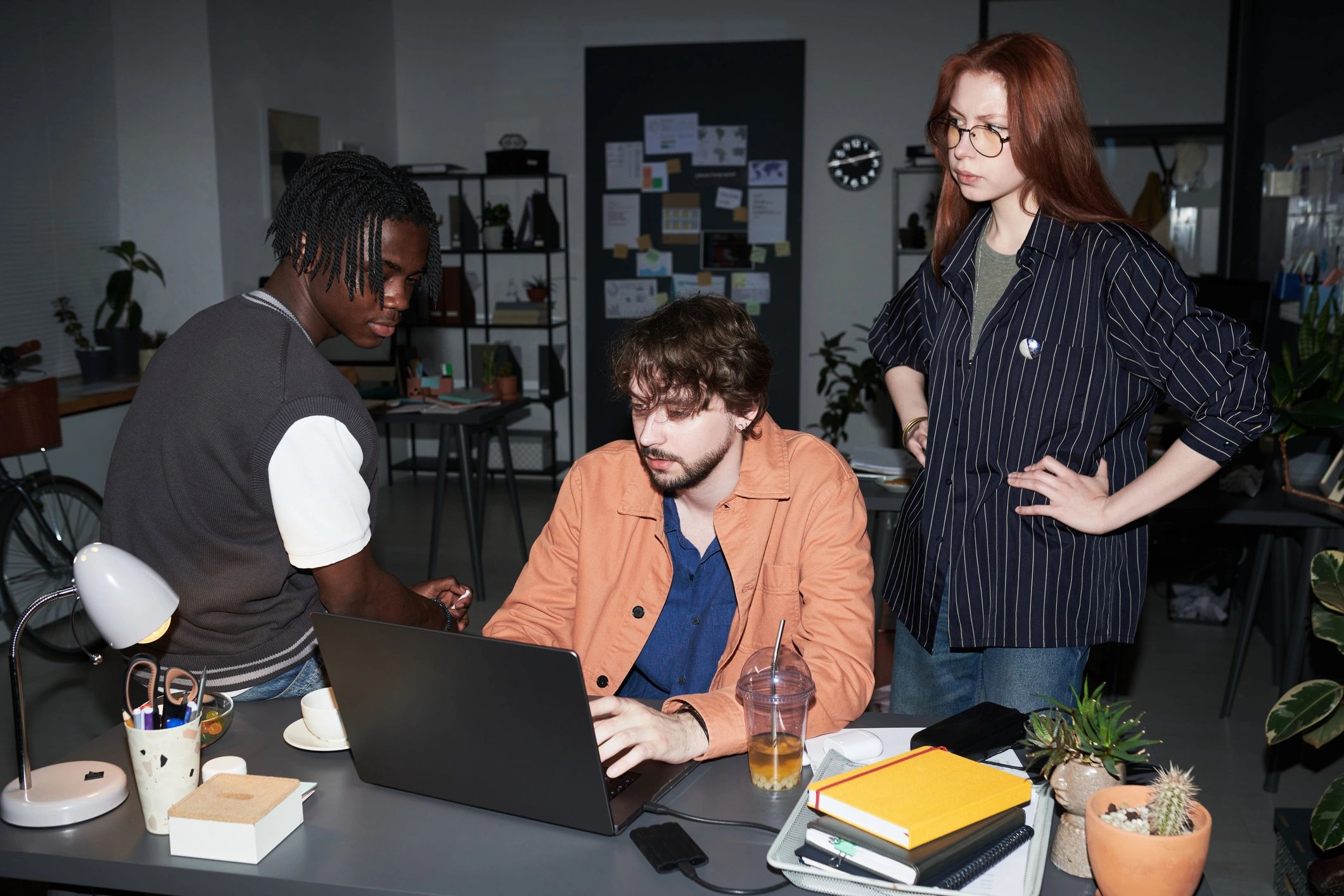 Professional collaborator reviewing strategy on laptop